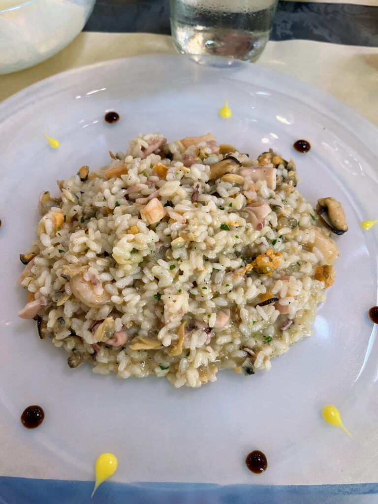 A place of risotto with different types of seafood