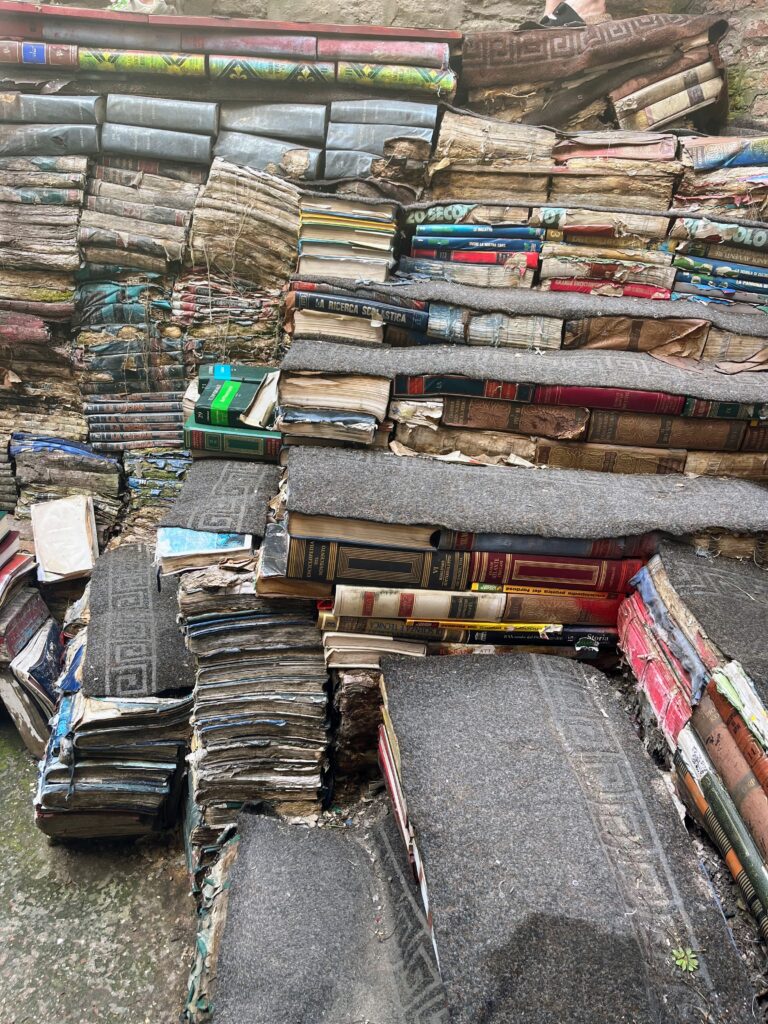 A staircase made of books with severe water damage